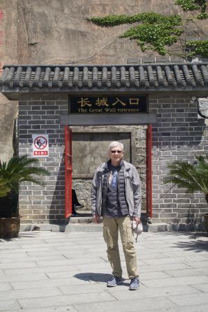 John young in front of the Great Wall of china entrance